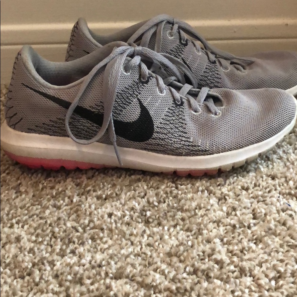 Gray black white pink Nike tennis shoes